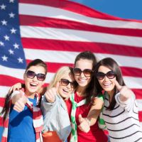 girls in front of flag New York